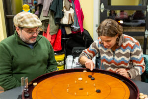 Danny & Libby flicking at Crokinole